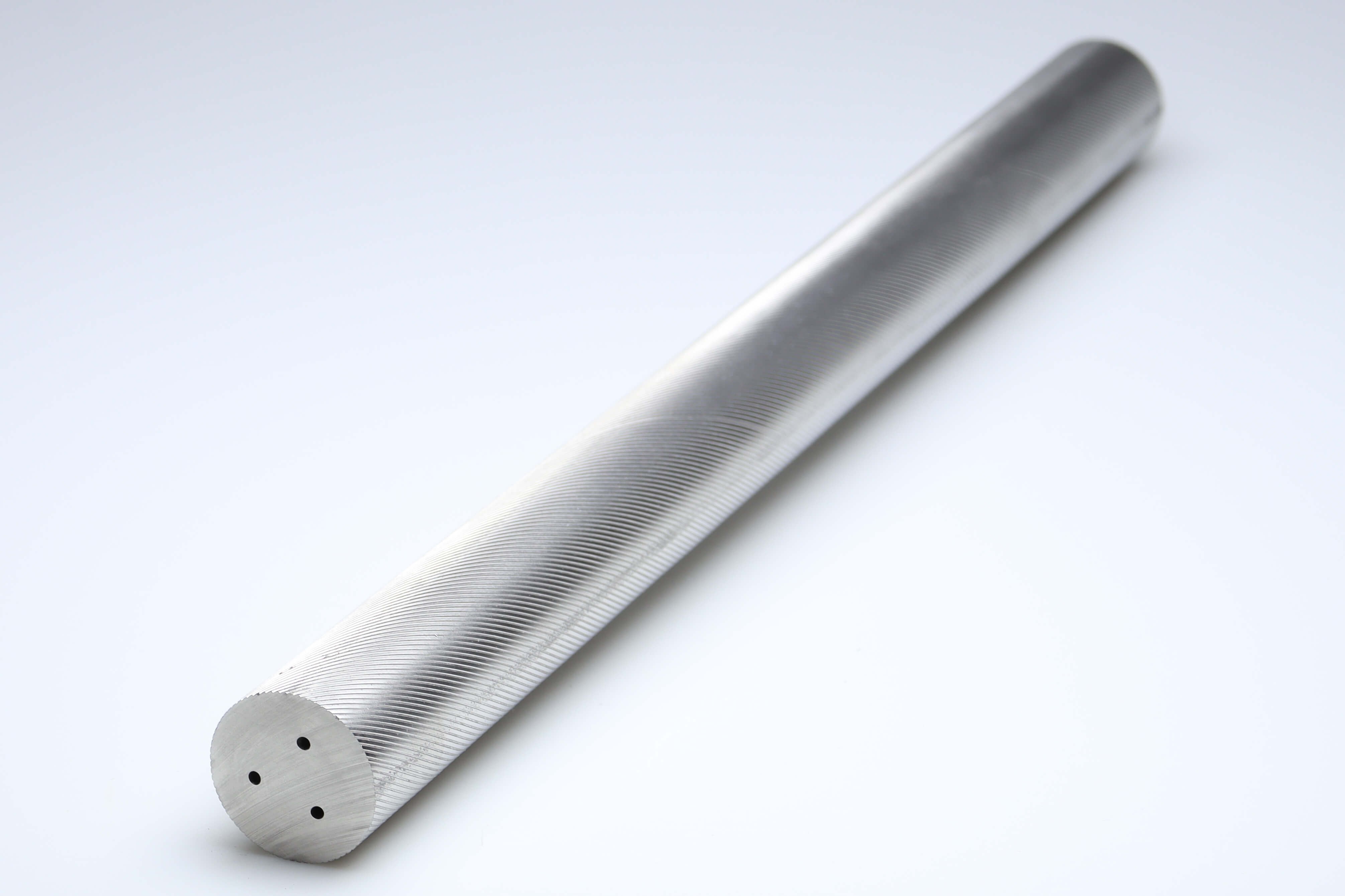 An unground carbide rod with 3 coolant holes