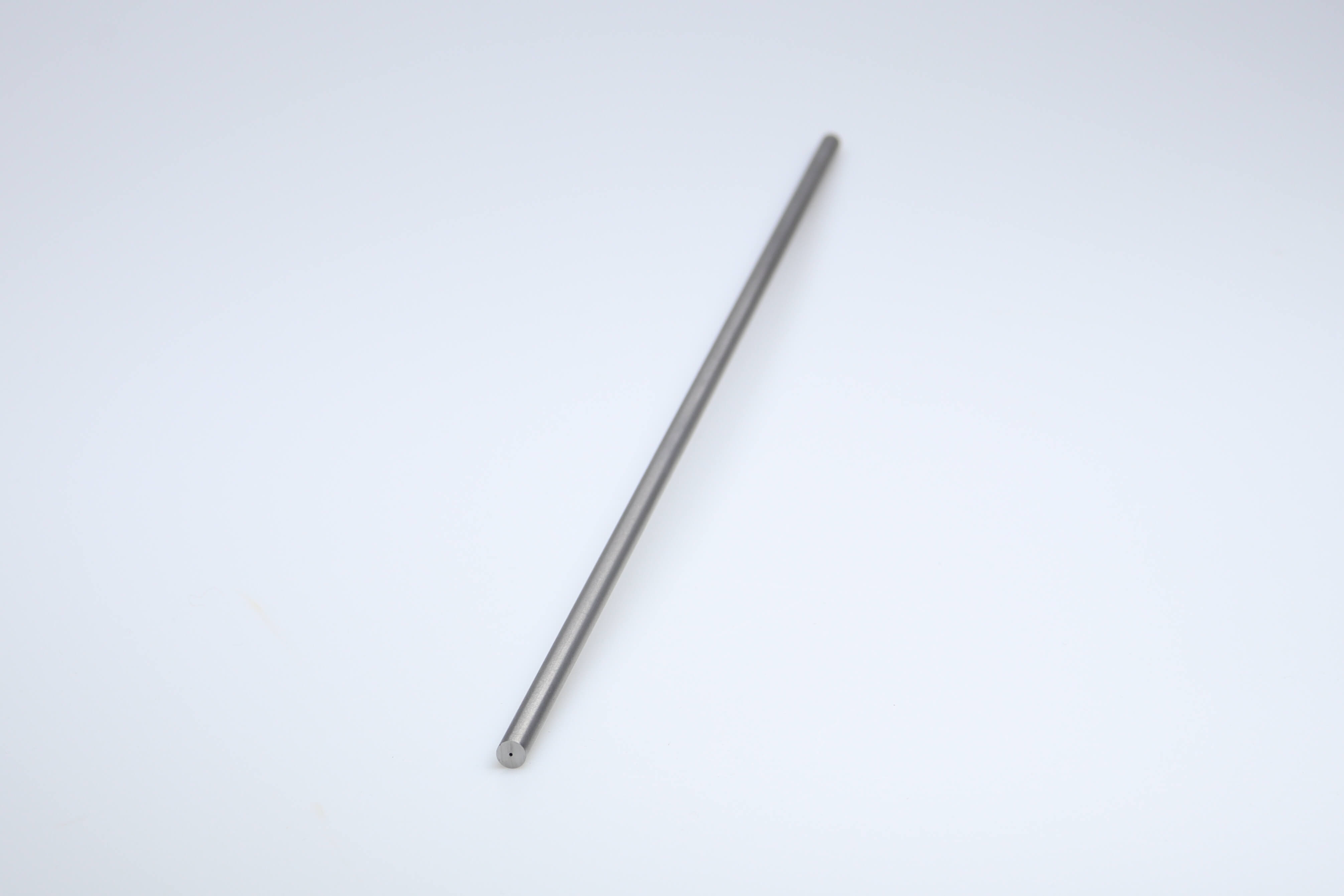 An unground carbide rod with 1 central coolant hole